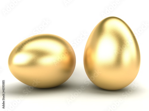 big gold Easter eggs on a white background