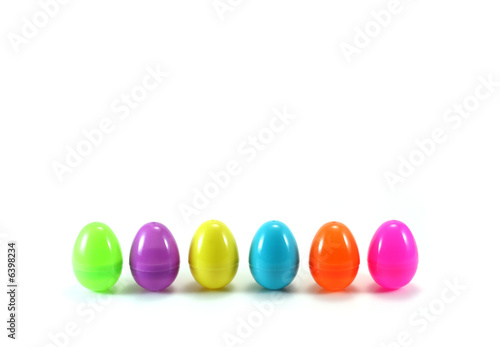Line of pastel Easter Eggs on white