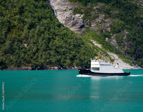A Ferry crosses Geiranger Fjord in Norway