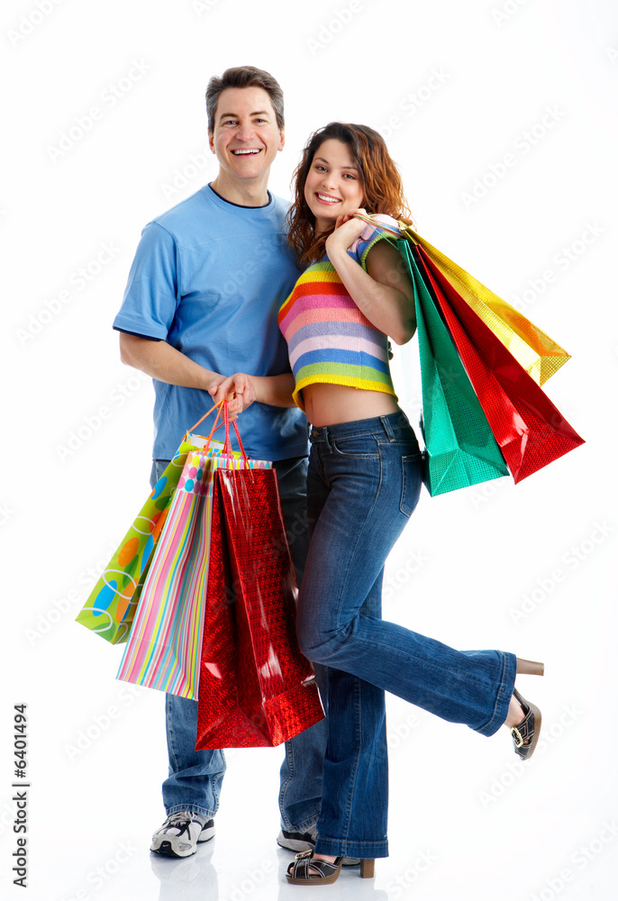 Shopping couple smiling. Isolated over white background. Shopping couple smiling. Isolated over white background.