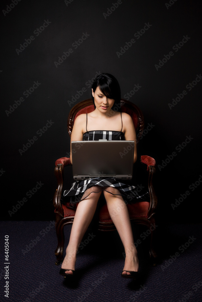 A portrait of a beautiful woman working on her laptop A portrait of a beautiful woman working on her laptop