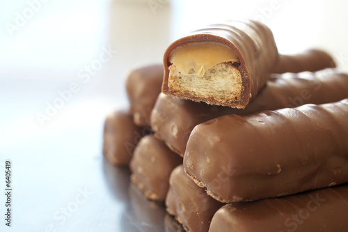 Tower of thin chocolate bars with one broken bar