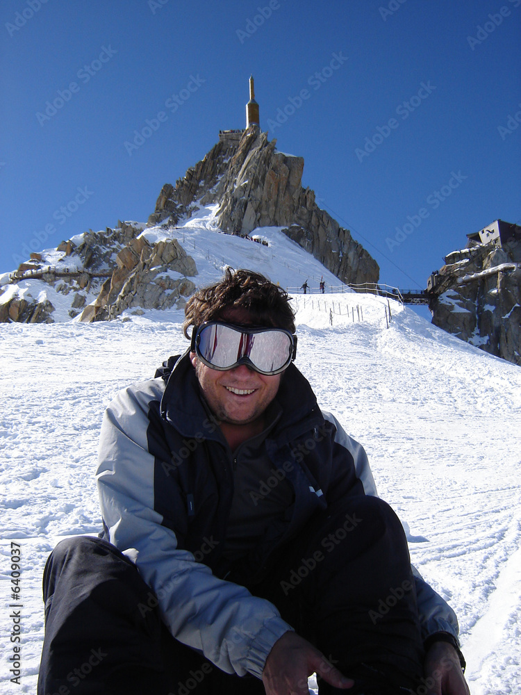 Snowboarder below the Aguille du Midi station, Chamonix