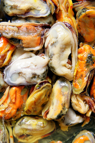 Mussels in oil close-up, may be used as background