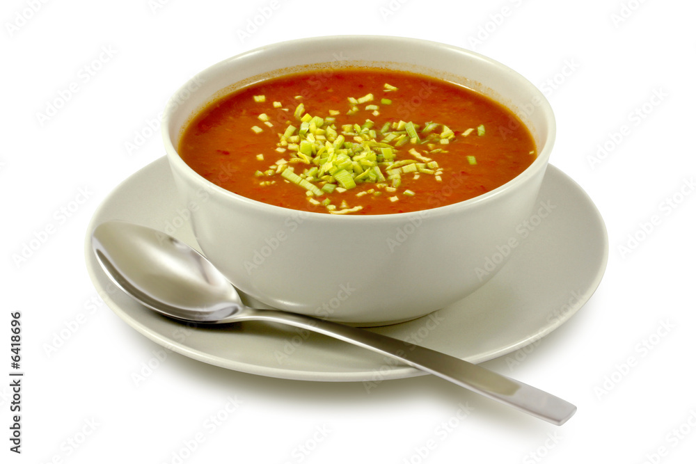 Delicious, creamy tomato soup in ceramic bowl on white Delicious, creamy tomato soup in ceramic bowl on white