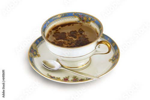 Aromatic  black coffee with chocolate in  old cup  on white 