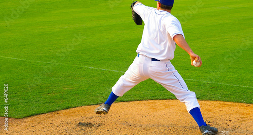 Professional baseball pitcher throwing the ball