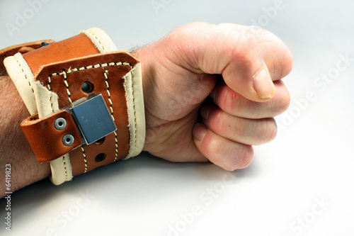 wrist restraint is applied and locked to a wrist photo