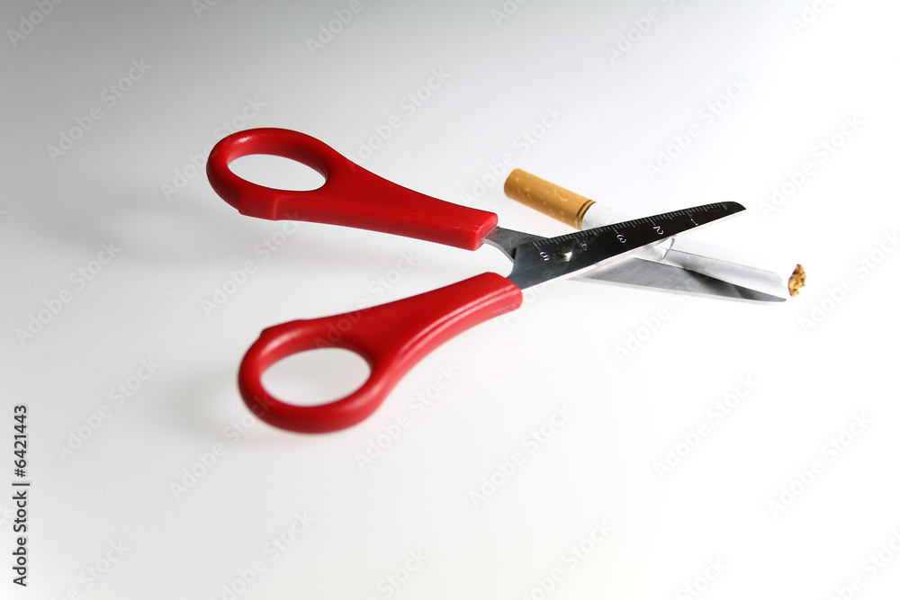 cutting cigarette scissors in white background cutting cigarette scissors in white background