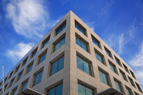 High modern building on a background of the blue sky