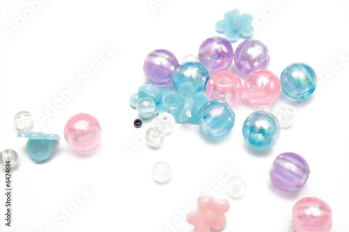 pink and blue beads on the isolated background