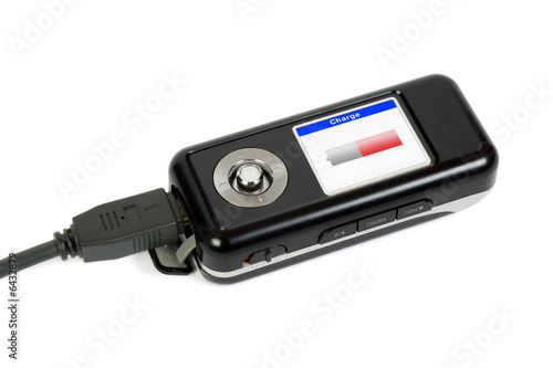 Charging mp3 player, isolated on white background
