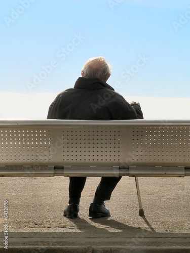 Old Gentleman sitting alone photo