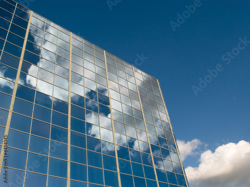 Clouds reflected in office windows photo