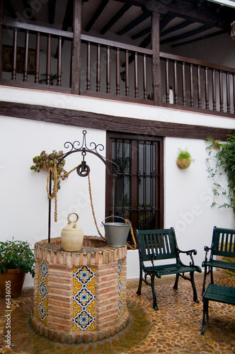 Well and botijo.In patio Castilla la Mancha. Toledo, Spain photo