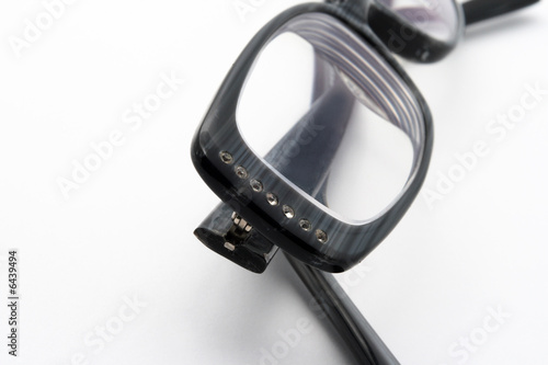 Black eyeglasses on white background