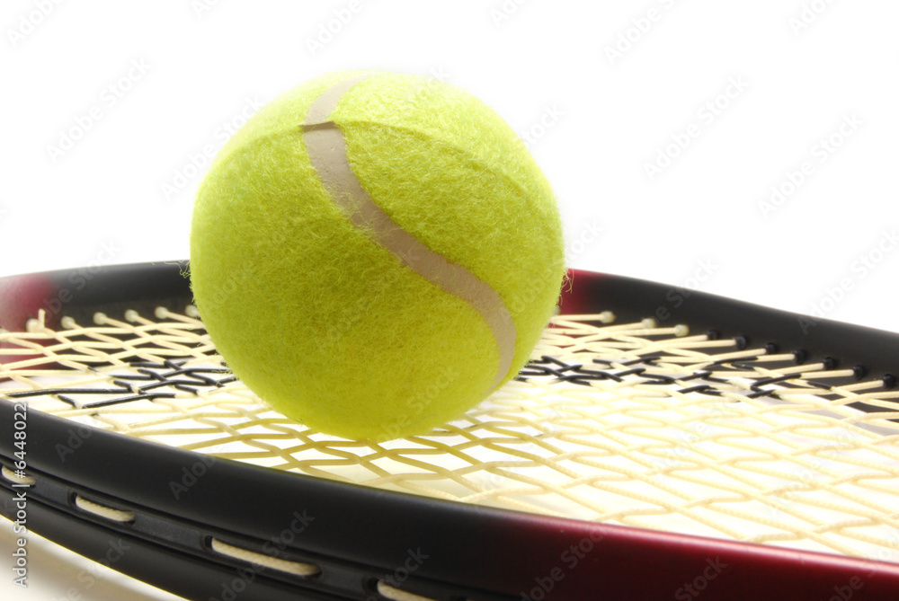 Tennis ball and racquet on white background