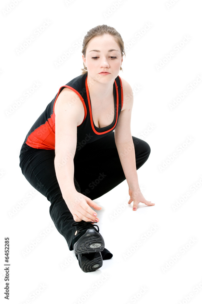 A young caucasian girl doing different stretches