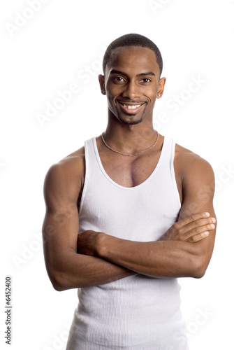 a muscular model is posing against white background