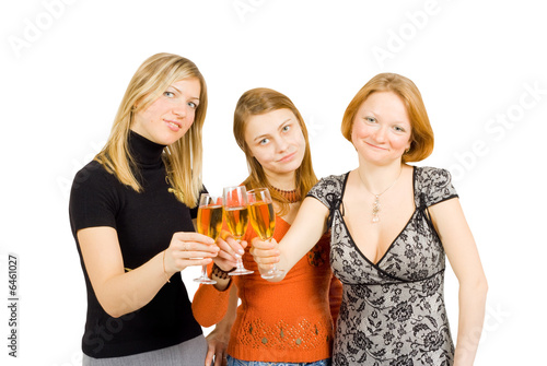 three girls with glasses of wine celebrating