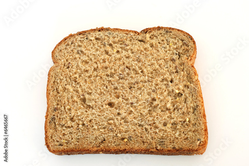High fiber multi grain whole bread slice isolated on white