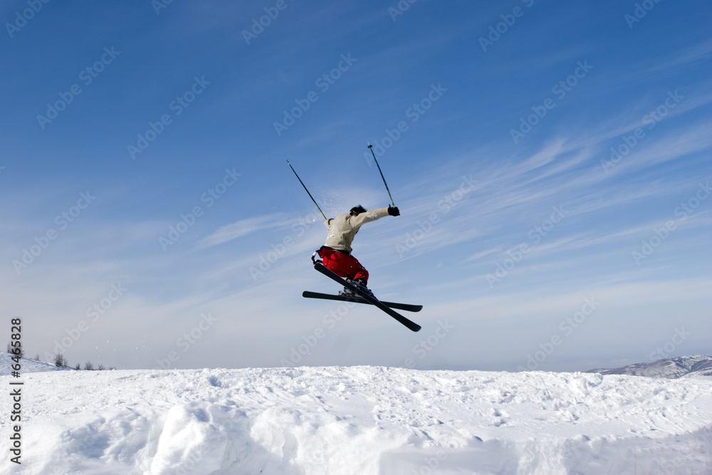 Snow Skier Jumping Against Blue Sky in winter Tien Shan Snow Skier Jumping Against Blue Sky in winter Tien Shan