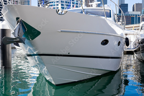 A moored luxury boat in a marina