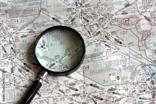 Map and magnifying glass