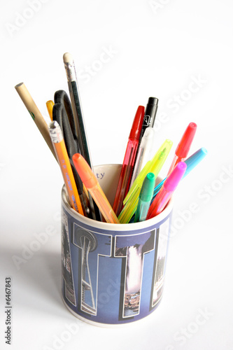In a cup pencils and pens