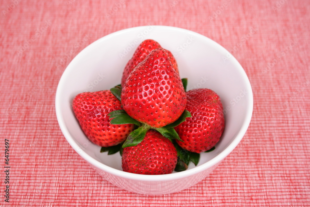 strawberries on red placemat strawberries on red placemat