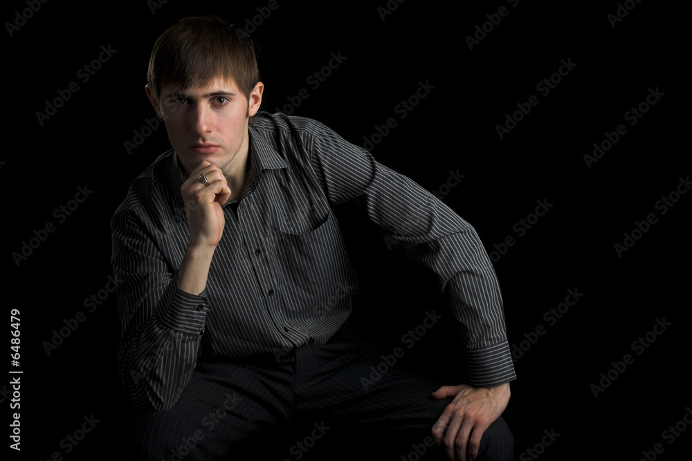 young man looking in camera isolated on white