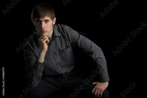 young man looking in camera isolated on white