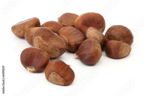 handful of edible chestnuts isolated on white background