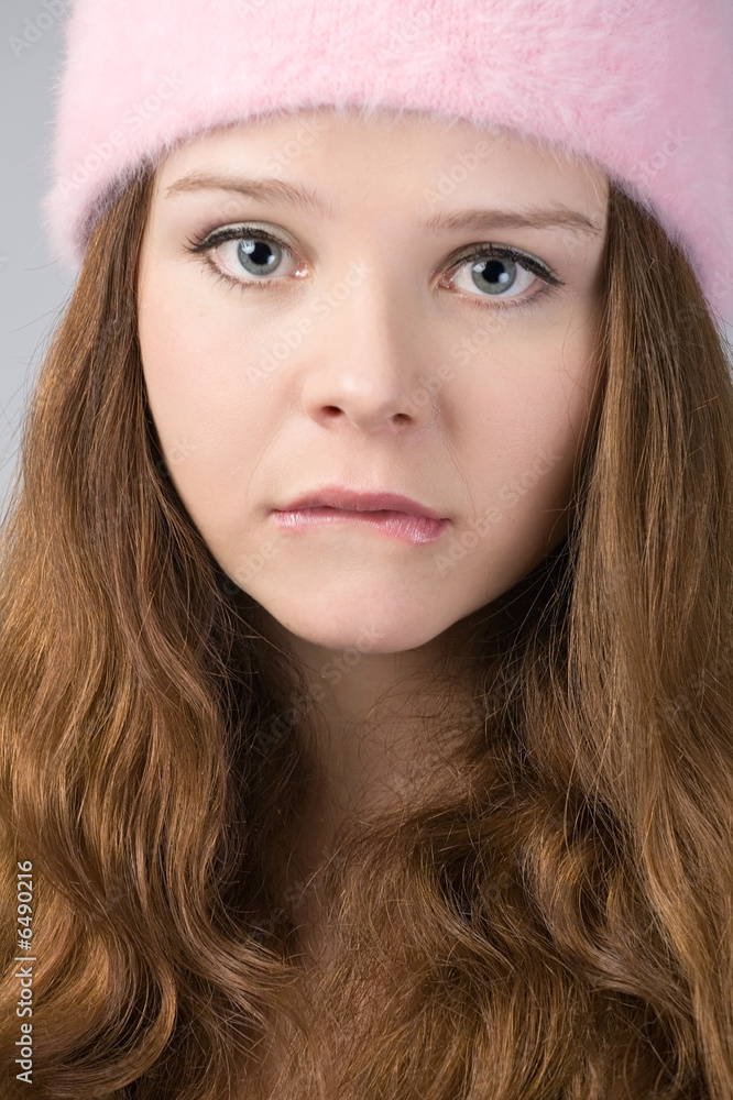 close-up portrait of sad woman in pink hat close-up portrait of sad woman in pink hat