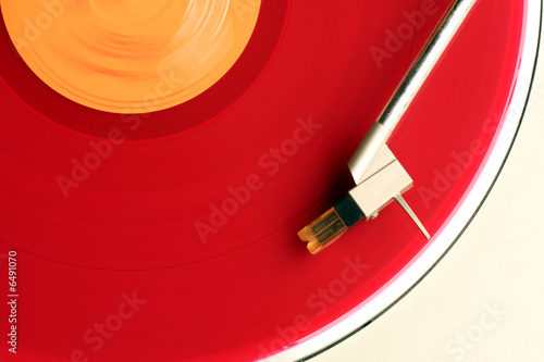 close-up of red album on turntable