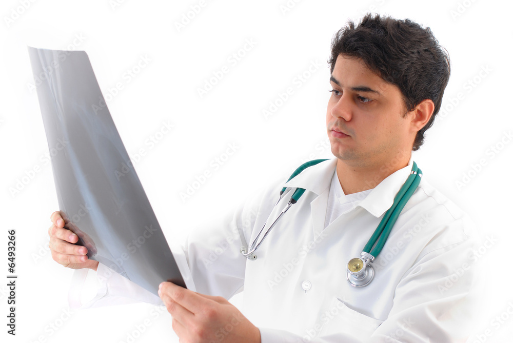 The Doctor with stethoscope Analyzing X-Ray . The Doctor with stethoscope Analyzing X-Ray .