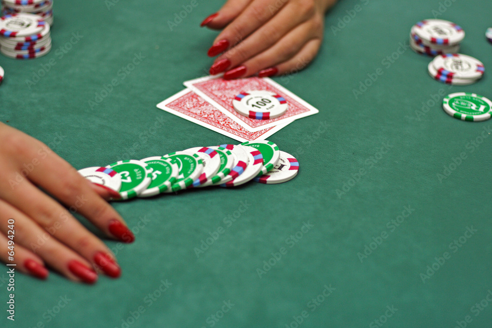 cards and chip in hand