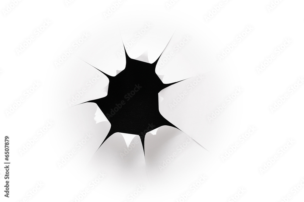 the sheet of paper with the cut hole against 2