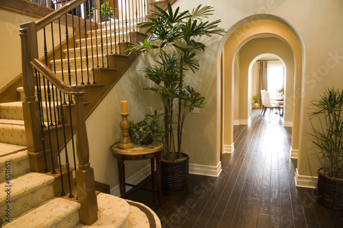 Luxury home hallway with a hardwood floor.
