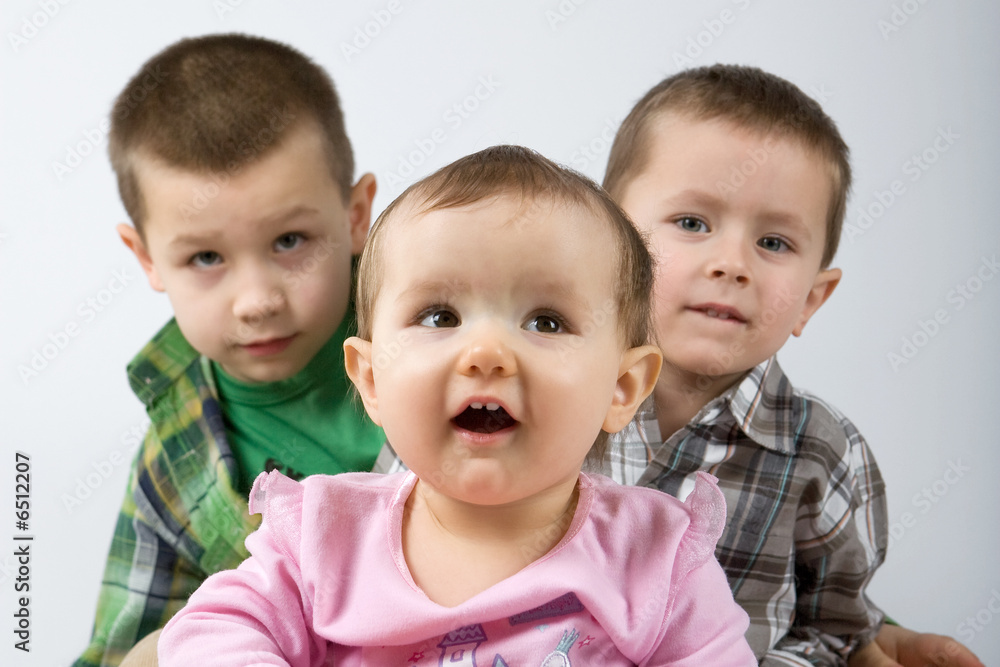 Cute caucasian siblings, one, four and eight years old. Cute caucasian siblings, one, four and eight years old.