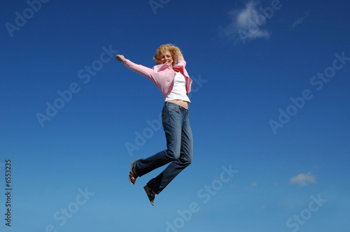 Jumping woman on a sunny day