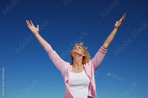 Woman with her arms wide open