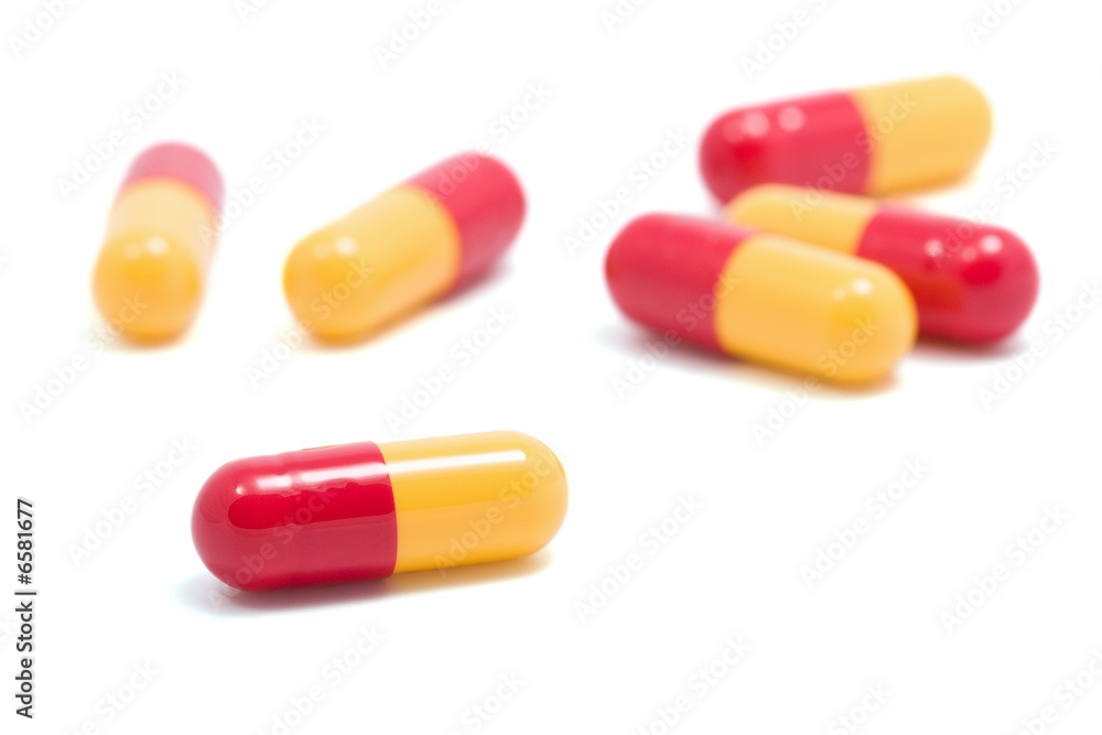 red and yellow capsule pills isolated red and yellow capsule pills isolated