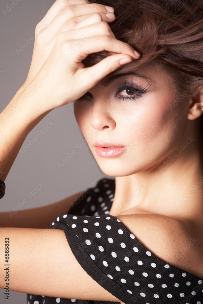 Obraz premium Young Woman with Windswept Hair