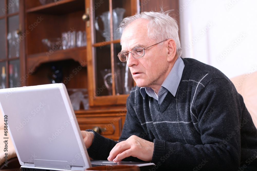 Senior man in front of his laptop Senior man in front of his laptop