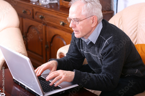 Satisfied man in front of his laptop