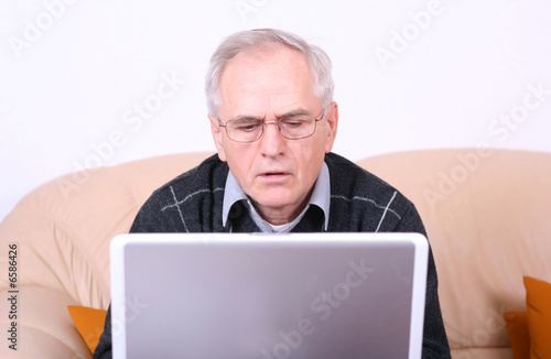 Senior man using a laptop