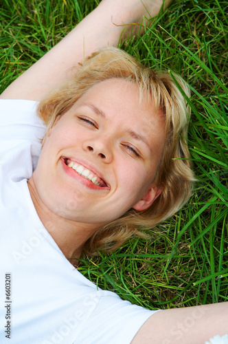 woman lie on grass photo