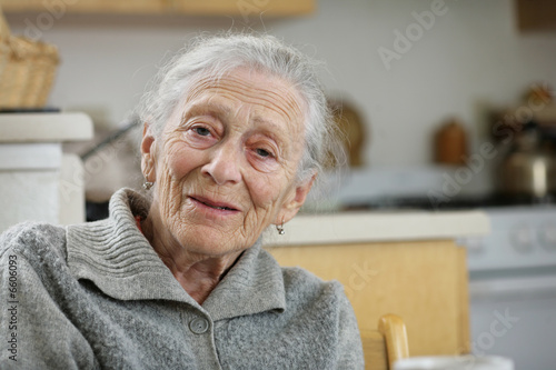 Картината върху платно Portrait of a senior woman at home