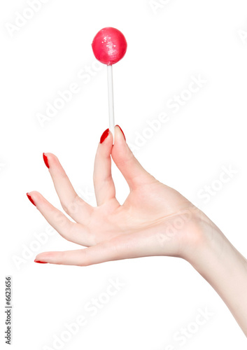 Woman hand with lollipop